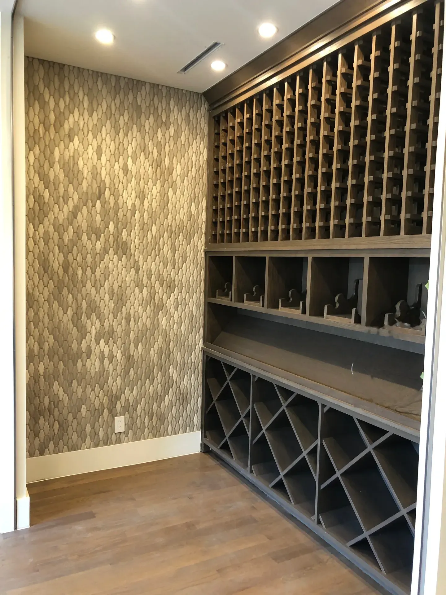 Custom wine room with floor-to-ceiling wood racking